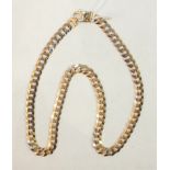 A modern 9ct gold necklace of flattened curb links, 51cm, 35g.