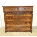 A 19th century Continental mahogany chest of two short and four long graduated drawers, on cut-