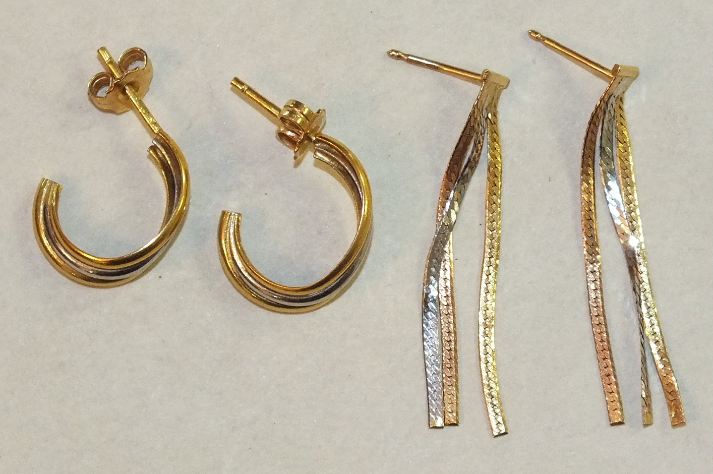Two pairs of tri-coloured 18ct gold earrings, with post fittings, 3.3g, (2).