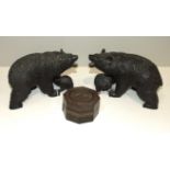 A pair of Oriental carved hardwood bears with cubs, having glass eyes (cub's eyes lacking), 11cm