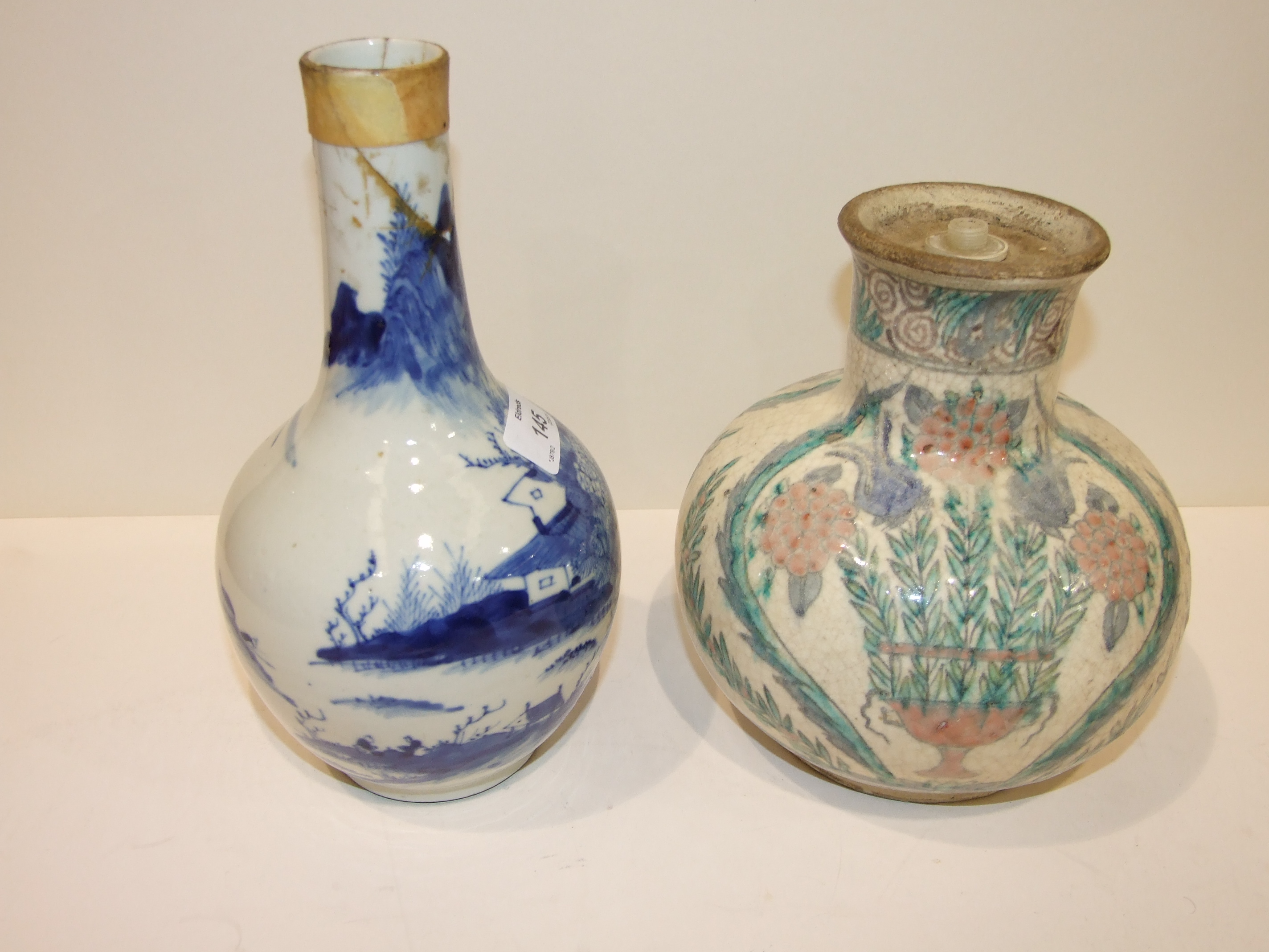 A 19th century Chinese blue and white bottle vase, (damages), 24cm and another, both converted to - Image 2 of 4