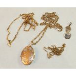 A 9ct gold locket on belcher-link chain, two other gold chains and a 9ct gold chick and egg pendant,