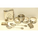 A silver cigarette case, 6.5 x 8.5cm, Chester 1911, four engine-turned silver napkin rings,