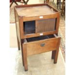 A mahogany tray-top commode with tambour door, 52cm wide.