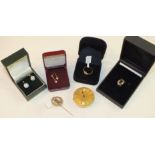 A 'Gems' 9k white gold pendant set citrine, boxed with certificate, an ornate gold and silver pin