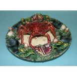 A Portuguese Palissy Ware dish decorated in relief with a spider crab, mussels and other