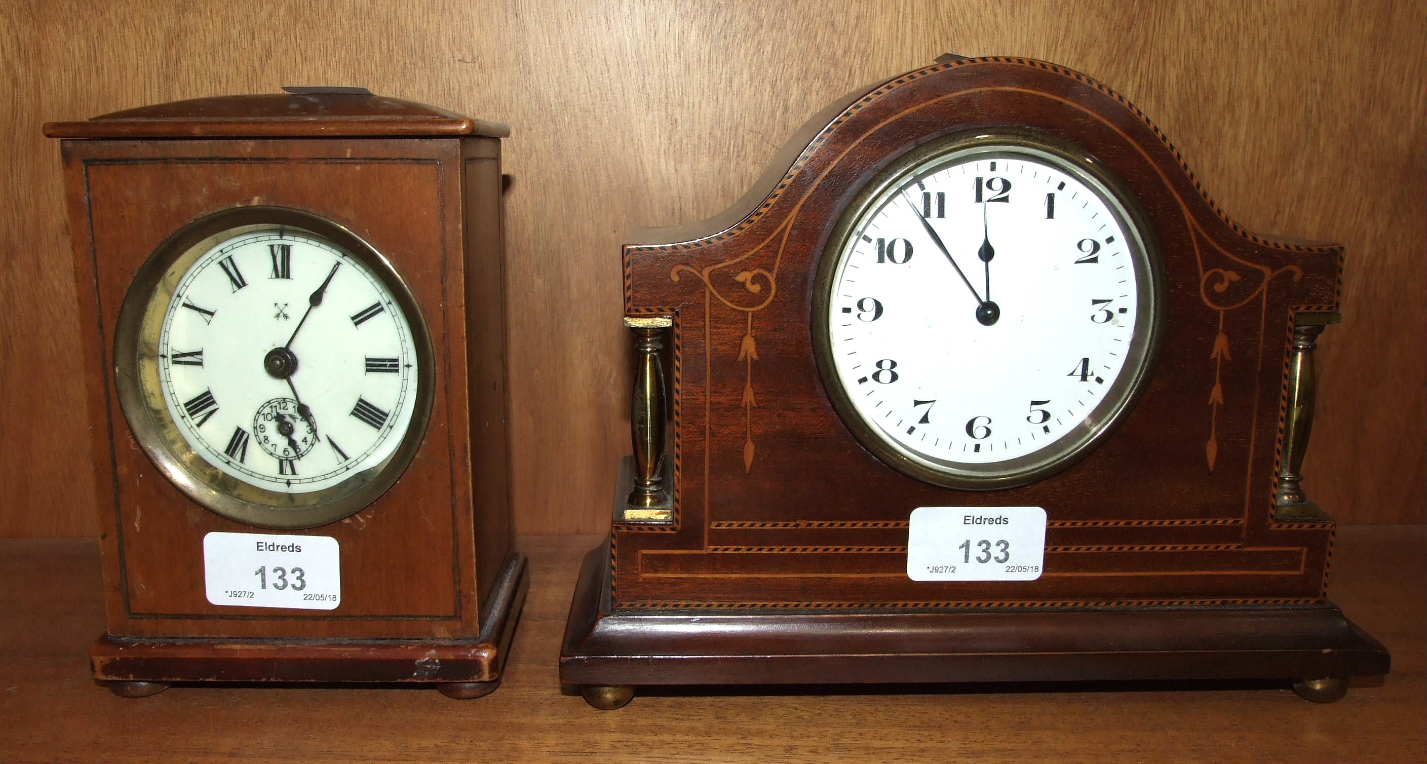 An HAC stained-wood-cased alarm clock with key-wind movement and bell strike, 16cm high, 12cm wide