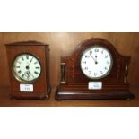 An HAC stained-wood-cased alarm clock with key-wind movement and bell strike, 16cm high, 12cm wide