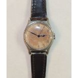 Omega, a WWII military wrist watch Calibre 30T2, the cream dial, (discoloured), with Arabic numerals