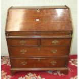 A 19th century oak bureau, the rectangular top above a fall front opening to reveal a fitted
