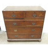 A 19th century teak two-part military chest of two short and three long drawers, on bun feet,