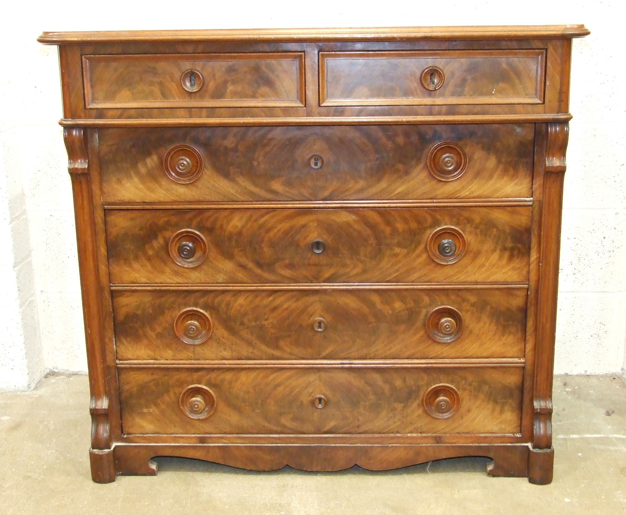 A 19th century Continental mahogany chest of two short and four long graduated drawers, on cut- - Image 2 of 4