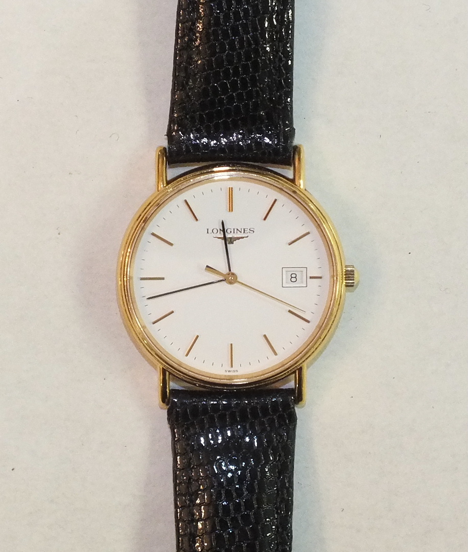 Longines, a gents gold-plated wrist watch, the white enamel dial with baton numerals, sweep