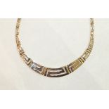 A suite of yellow gold jewellery of Greek key pattern design, comprising necklet, bracelet, (a/f),