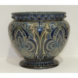 A Doulton Lambeth stoneware jardinière by Edith D Lupton, dated 1881, with overall blue stylised