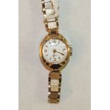 Rotary, a ladies 9ct-gold-cased wrist watch on 9ct gold tapering bracelet, 14.1g.