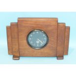 A Smiths car clock set into a wooden case.