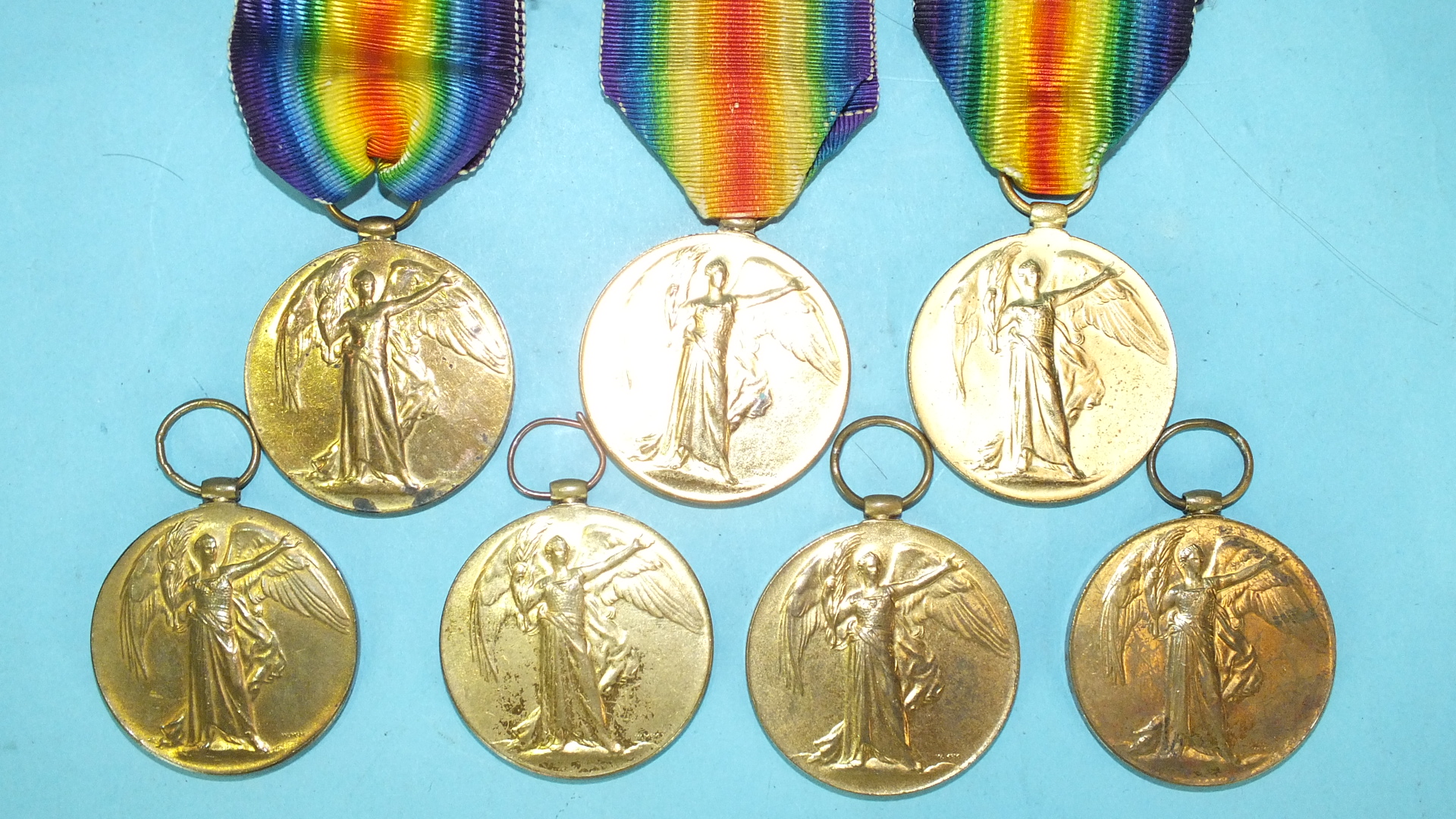 Seven WWI Victory medals: 20607 Pte J H Cook Devon R; 241098 Pte S E Popplestone Devon R; 25944