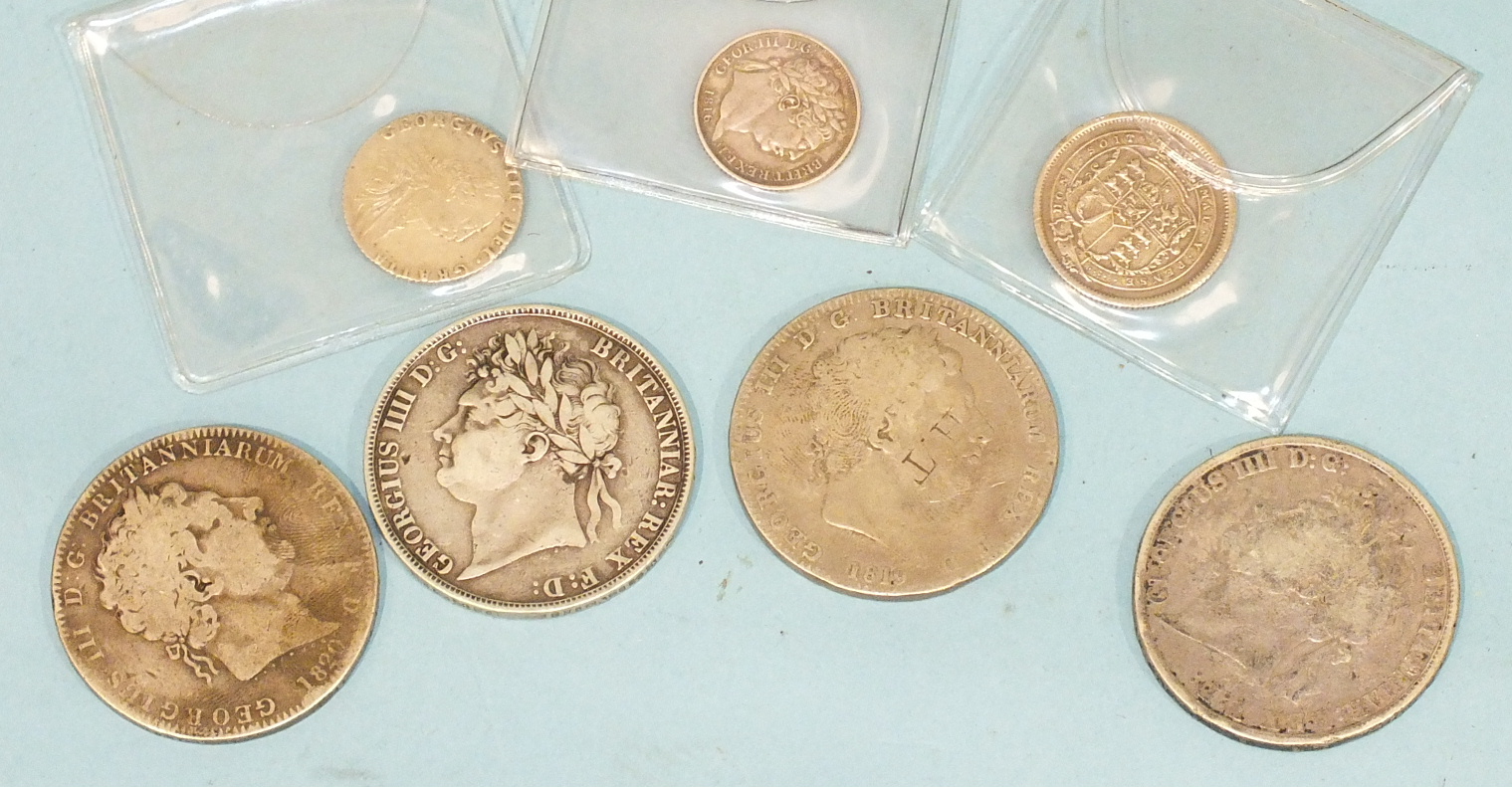 Four George III crowns, 1819, 1820, 1821, 1822, a shilling 1816, two sixpences 1787, 1816, (7).