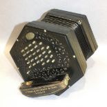 A Lachenal & Co. concertina with pierced ebonised ends, 56 chrome keys and sevenfold bellows,