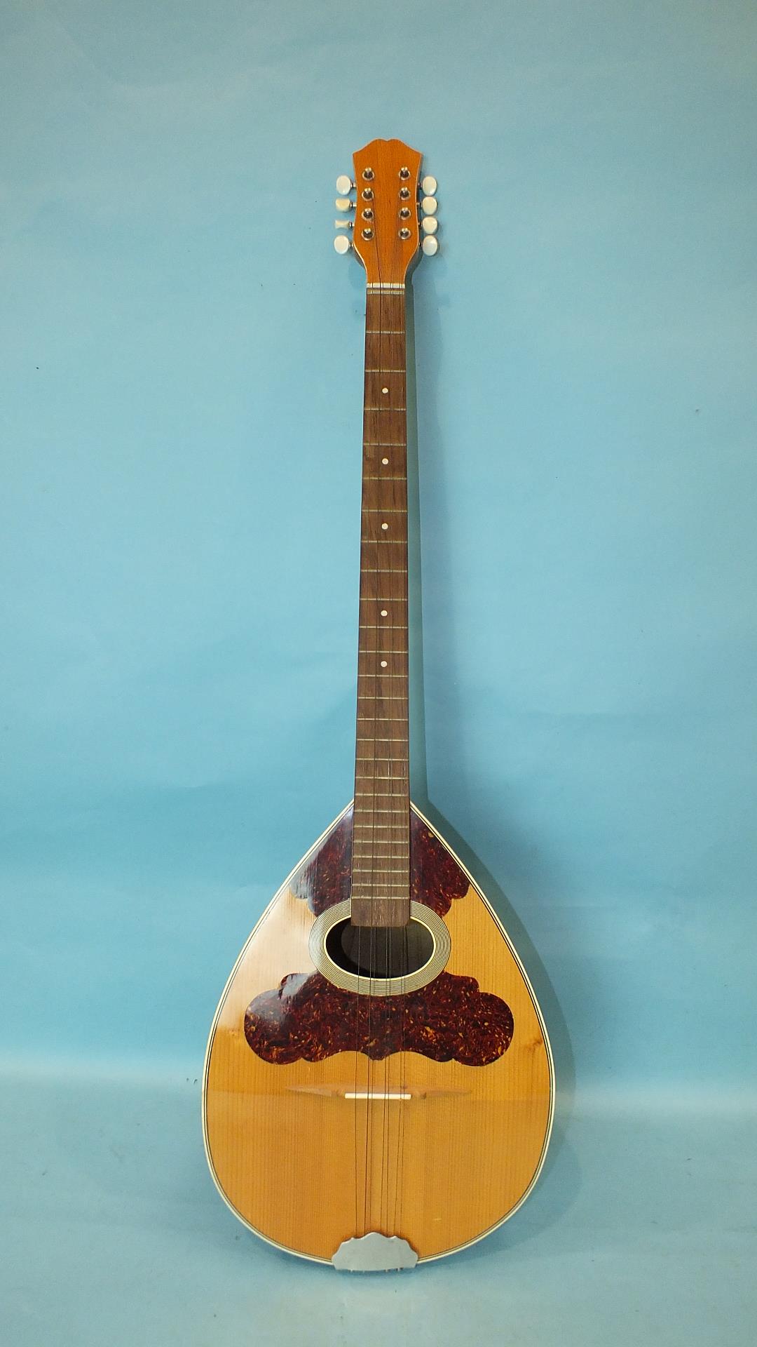 A modern 8-string bouzouki with bowl back and tortoiseshell inlaid soundboard, 99cm.