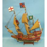 A scratch-built wooden model of the 'Golden Hind' on stand, 61cm wide, 61cm high, sold together with