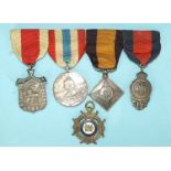 Four Victorian Army Temperance Association silver medals, on ribbons and one other temperance