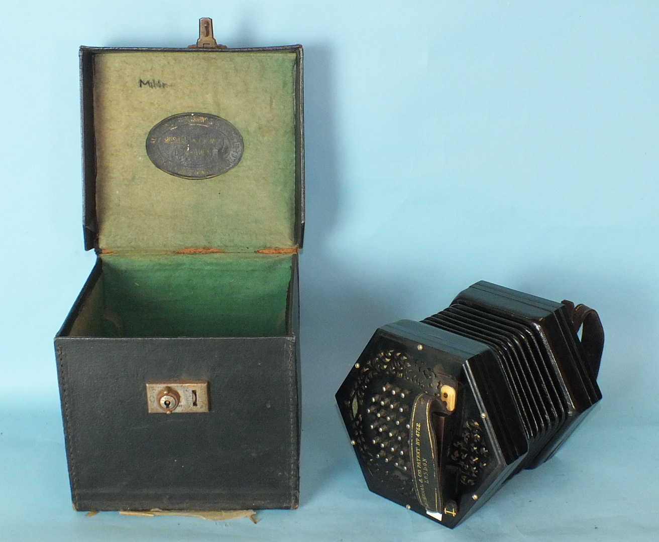 A Lachenal & Co. concertina with pierced ebonised ends, 56 chrome keys and sevenfold bellows, - Image 5 of 5