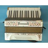 A Hohner Vineta piano accordion.