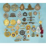 A quantity of cap and other badges, mainly military, to include 'Irish Lights' and 'Bombay Jail