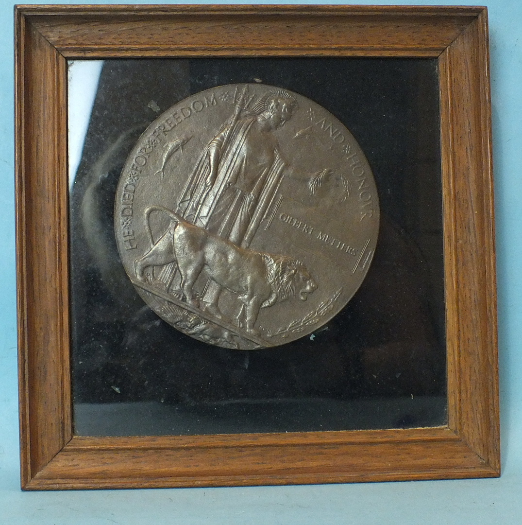 A WWI memorial plaque to Gilbert Metters, framed.