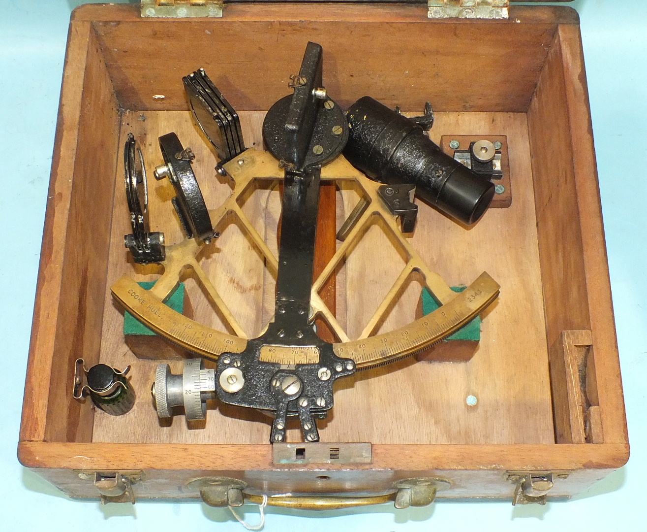 A brass and blackened metal sextant numbered 2343 by Cooke, Hull, in fitted box.