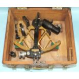 A brass and blackened metal sextant numbered 2343 by Cooke, Hull, in fitted box.