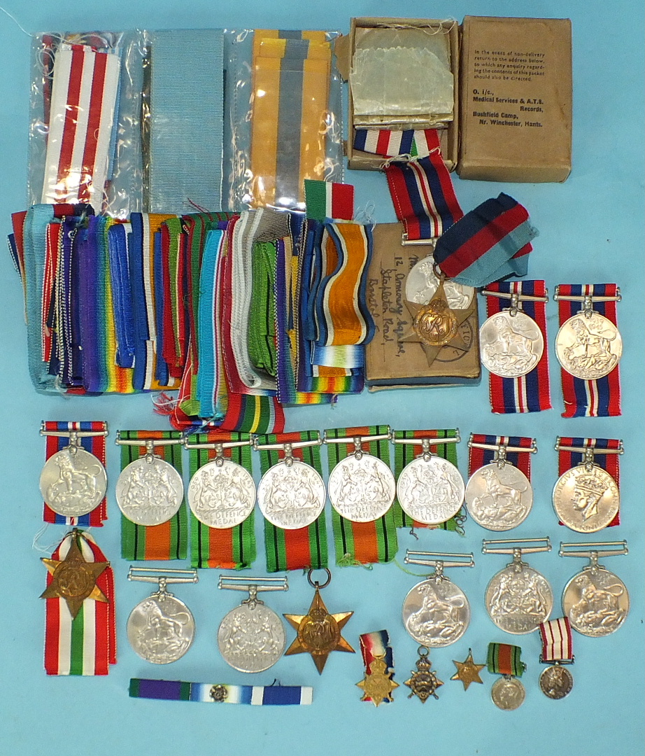 Three WWII medals in glassine envelopes and OHMS box, unnamed, a WWII pair in OHMS box for Mr F E