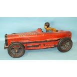 A resin model of a 1930's racing car with driver, 71cm long.