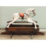 A small painted rocking horse in need of restoration, horse 90cm long, 64cm high, 138cm x 83cm,