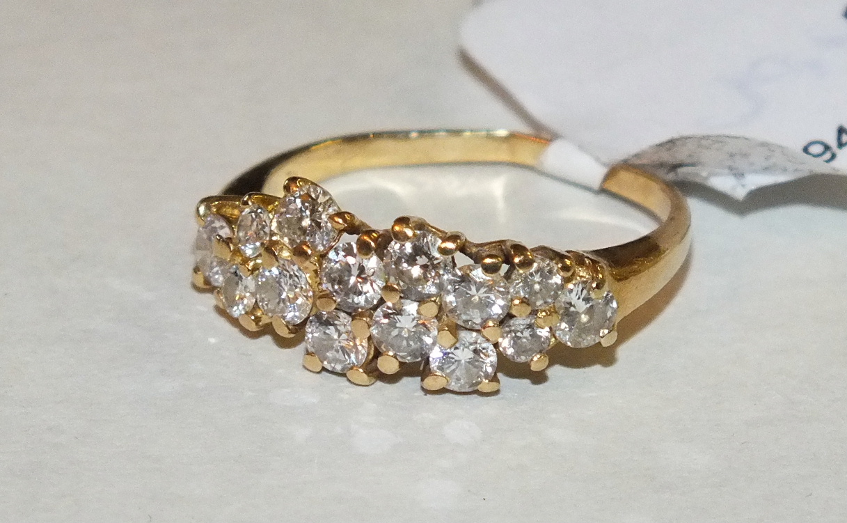 A diamond cluster ring claw-set fourteen brilliant-cut diamonds in 18ct yellow gold mount, size J,