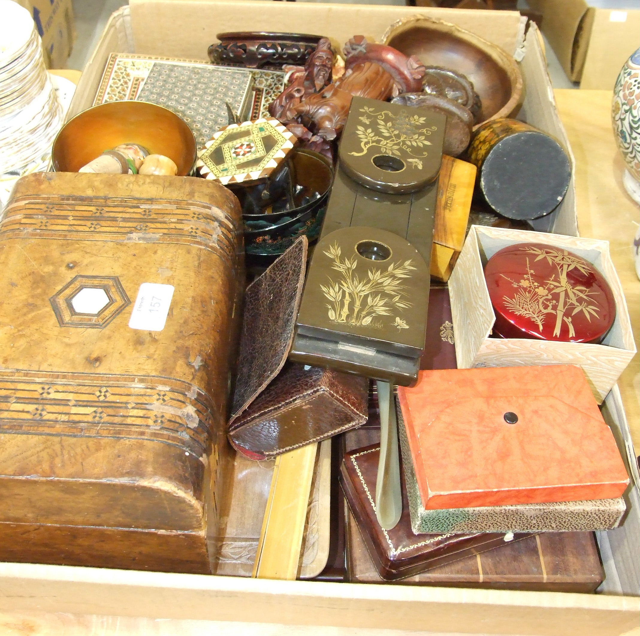 A collection of various wooden and lacquered items, including boxes, bowls, figures, two framed oval