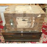 A zinc-lined metal-bound pine trunk with various luggage labels, Bombay, Karachi, White & Co, etc,
