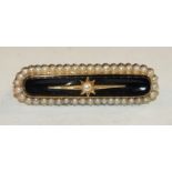 A Victorian onyx and pearl-set mourning brooch in 15ct gold mount, with locket back, 4cm long, 9g,