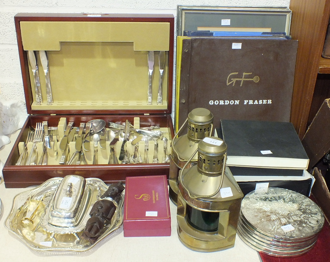 A part-canteen of 'community plate' cutlery in fitted box, other plated ware, a pair of brass 'Port'
