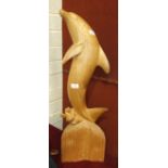 A carved wood figure of a leaping dolphin, 81cm high.