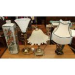 An Oriental ceramic table lamp, one other and two brass table lamps, (4).