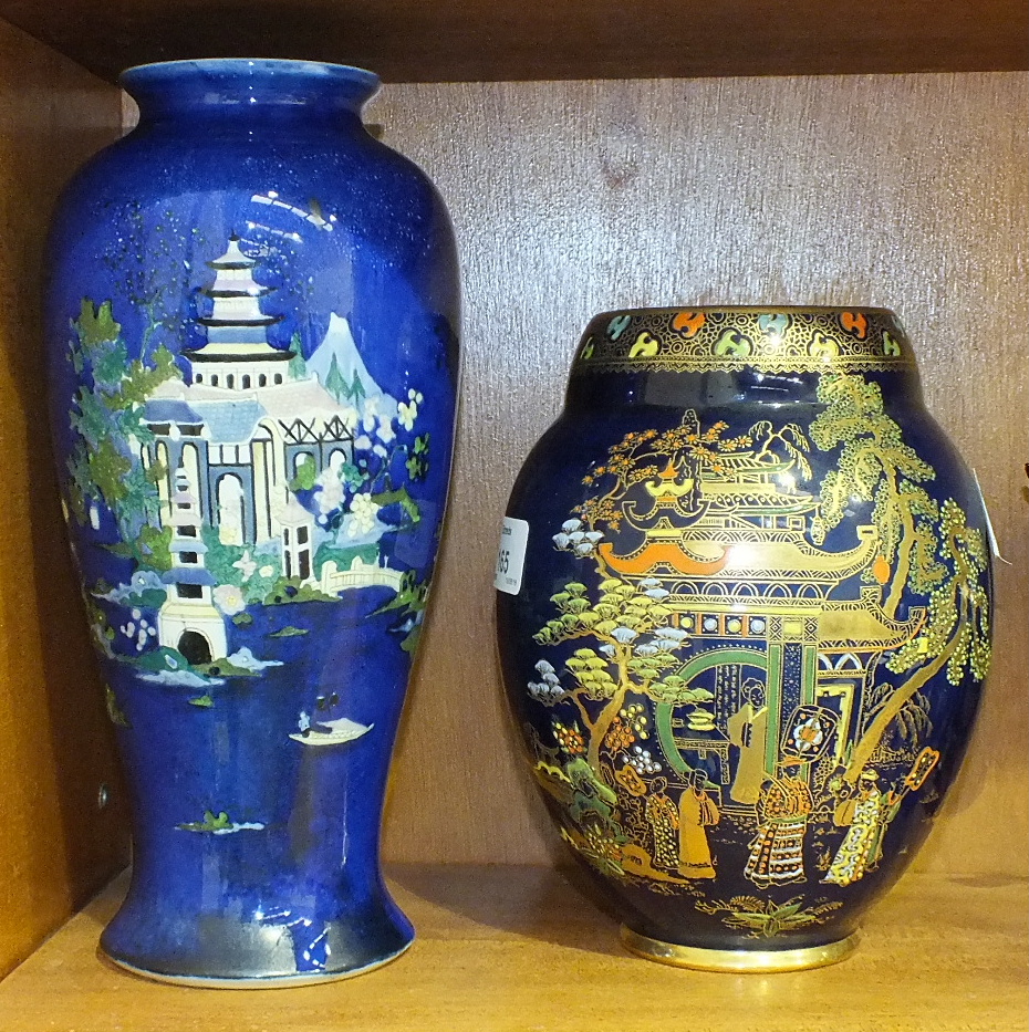 A Wiltshaw & Robinson Carltonware baluster shape vase decorated with pagodas and figures on a blue