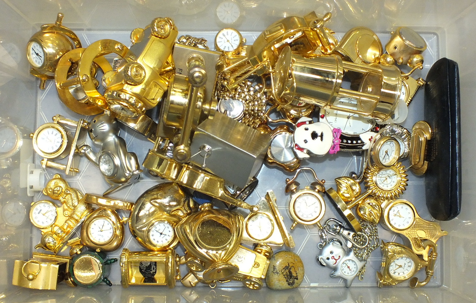 Approximately forty modern miniature clocks.