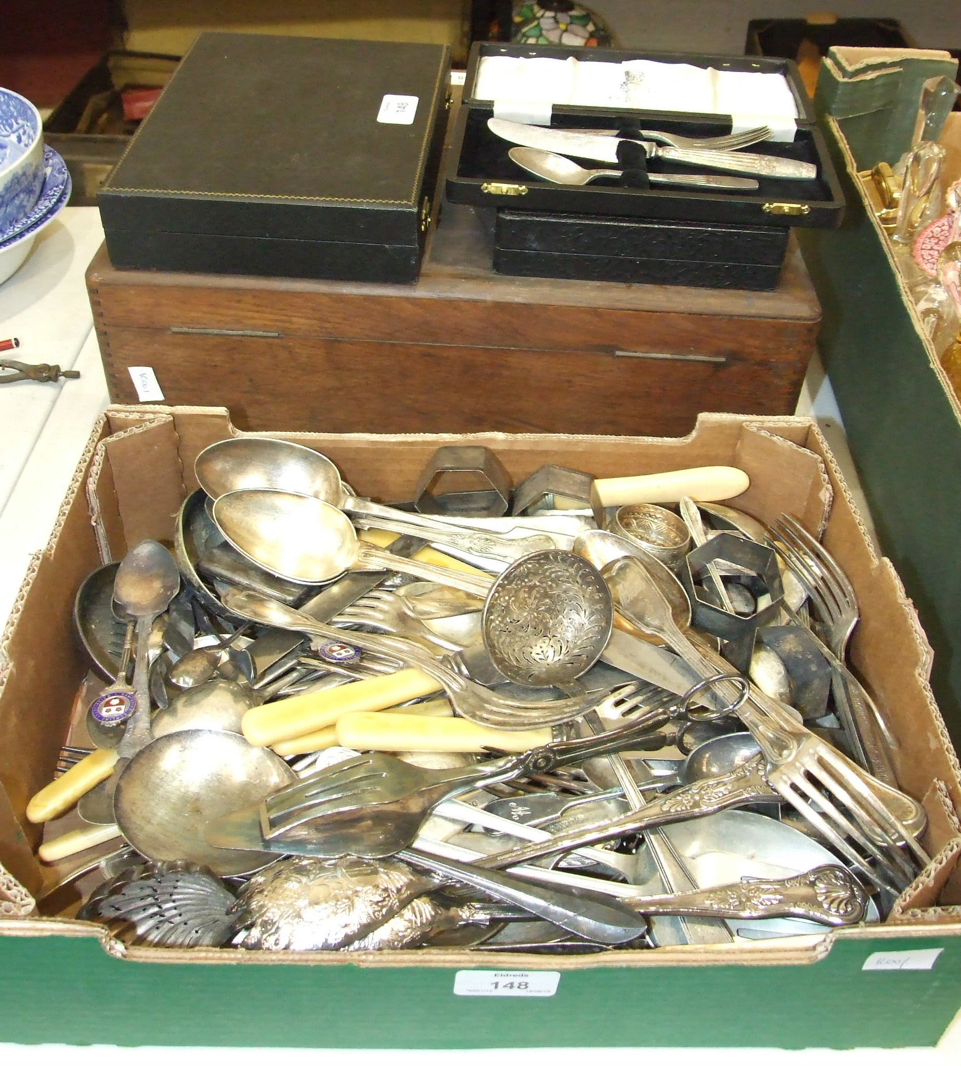 A part-canteen of French plated cutlery in wooden box and a quantity of loose plated cutlery.