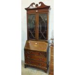 An Edwardian inlaid cross-banded mahogany bureau/bookcase, 81cm wide, 215cm high.