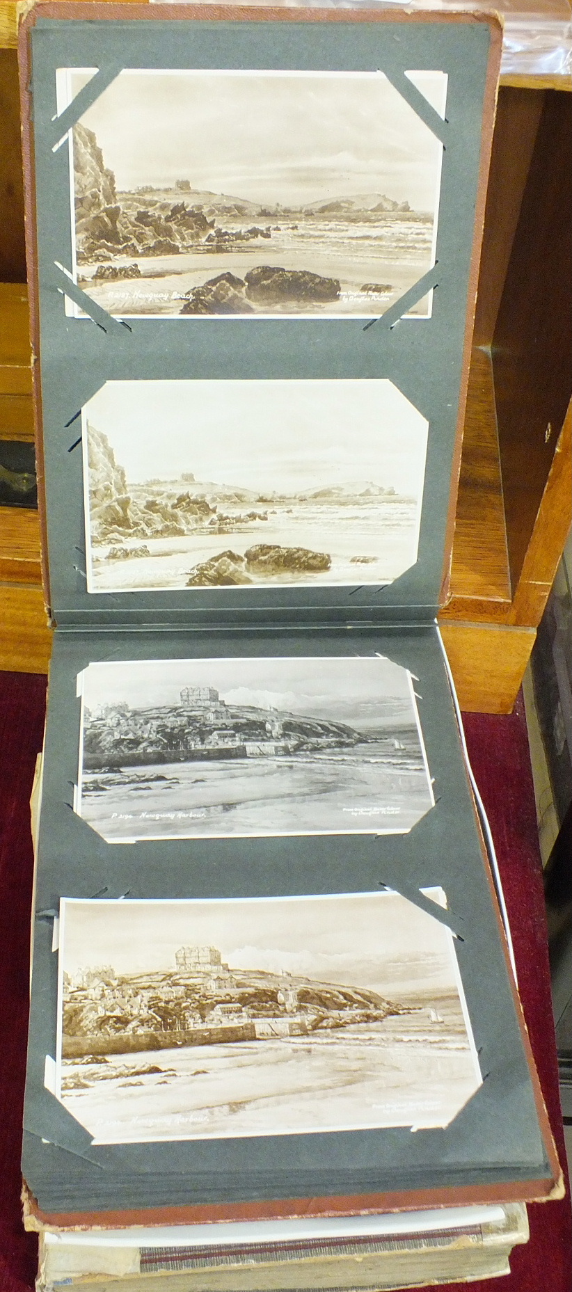 Approximately 450 loose topographical postcards, UK, including some by A R Quinton, an album of