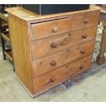 A stripped pine straight-front chest of two short and three long drawers.