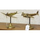 A brass Spitfire desk stand, 15cm high and another of a Mosquito aeroplane, 16cm high, (2).